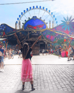 pink skirt german influencer at tomorrowland, tomorrowland