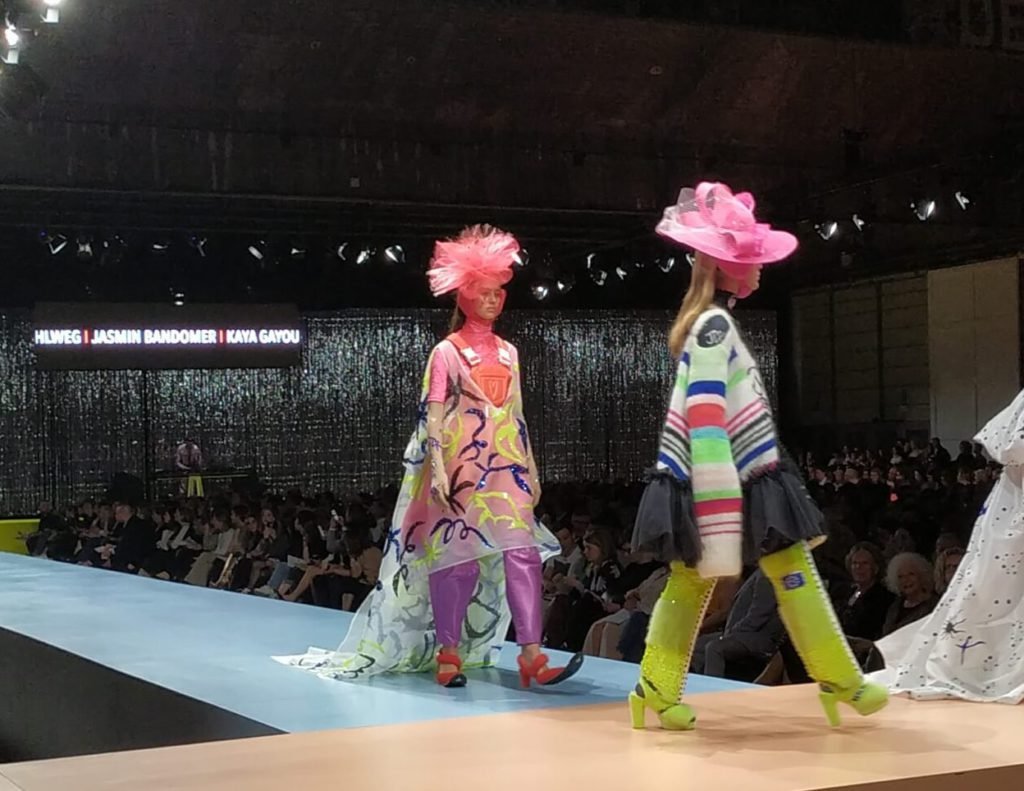 Royal Academy Fashion Show in progress where we see models walking the ramp