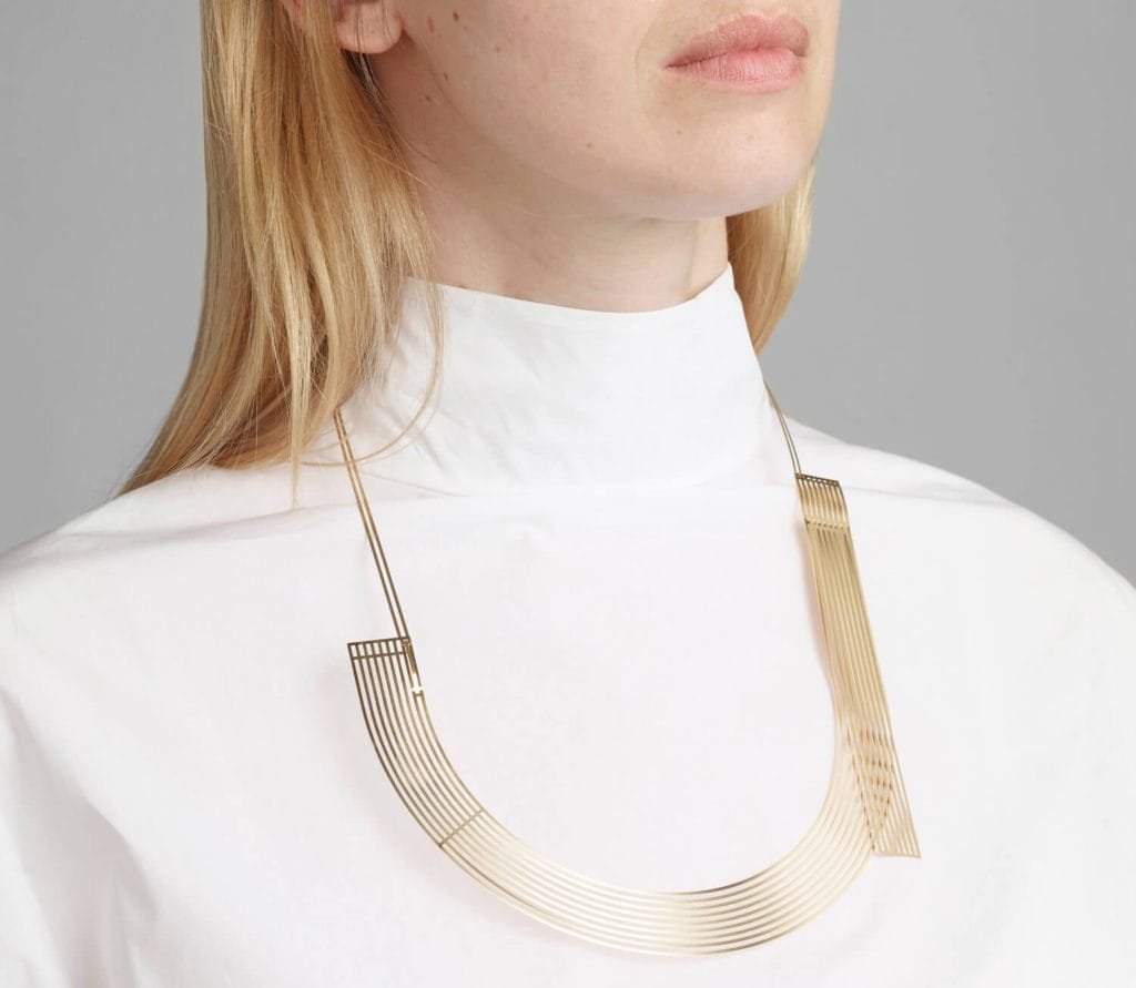 Detailed view of Mayre wafer-thin neckpiece.