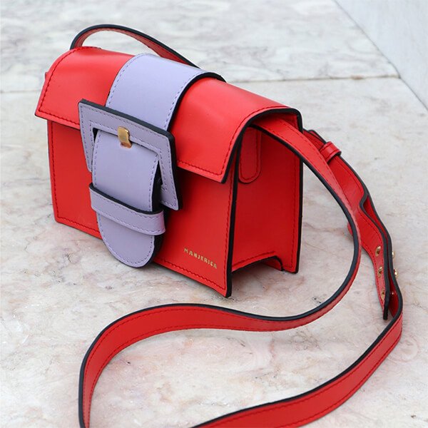 Discover Manjerica—handmade Portuguese leather handbags featuring artistic textures, shapes, and colors, priced between €190–€490.