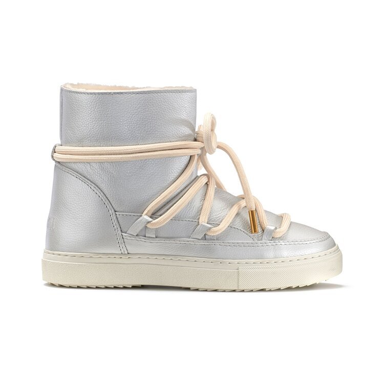 winter snow boots by Inuikii which can make any skiwear look elegant