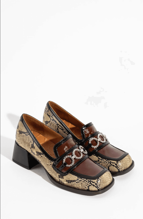 CC SKOR printed square-toe mules.