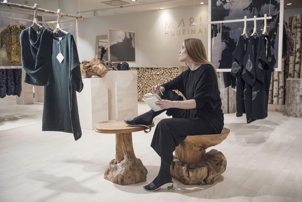 Designer MARITA HUURINAINEN in her boutique.