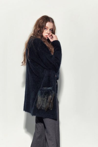 MARITA HUURINAINEN black fur coat.