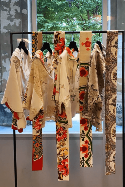 Rianna + Nina clothes hanging on rack.