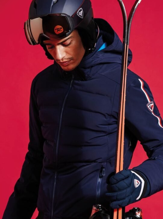 A close up look of a ski jacket which is navy blue in color